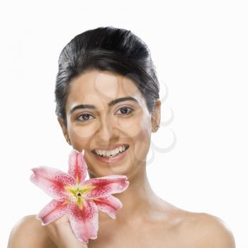 Portrait of a fashion model holding a flower
