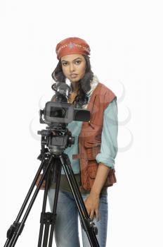 Portrait of a female videographer videographing