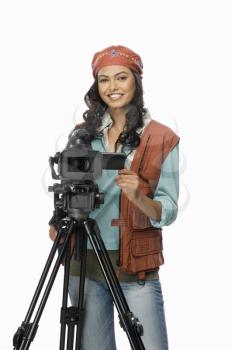 Portrait of a female videographer videographing
