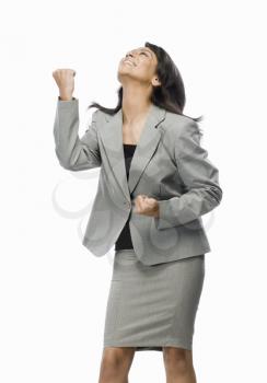 Businesswoman clenching her fist with joy