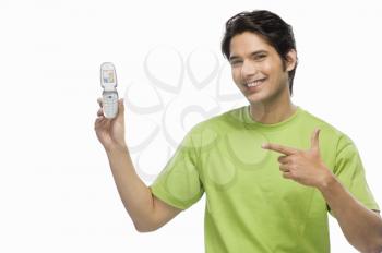 Young man showing a flip phone