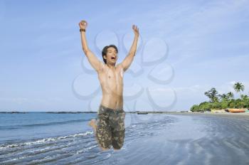 Young man jumping with joy