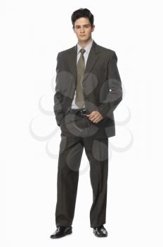 Portrait of a businessman holding his eyeglasses