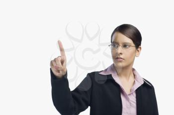 Businesswoman pointing with her finger