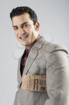 Businessman with a newspaper under his arm