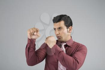 Businessman in boxing pose