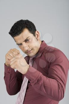 Businessman in boxing pose