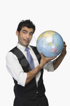 Businessman showing a globe