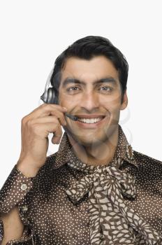 Portrait of a male customer care representative wearing a headset