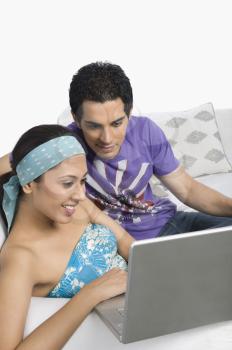 Couple using a laptop