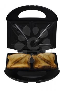 Close-up of a toaster with bread slices