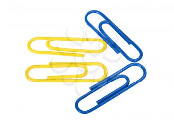 Close-up of paper clips arranged in arrow shape