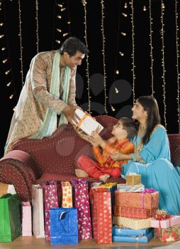 Family with shopping bags and gifts on Diwali festival