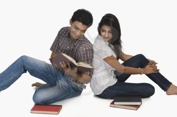 College students reading a book