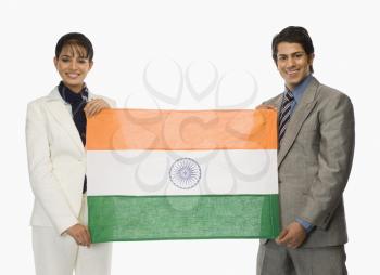 Business executives holding Indian flags