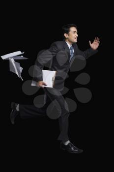 Businessman running with a clipboard
