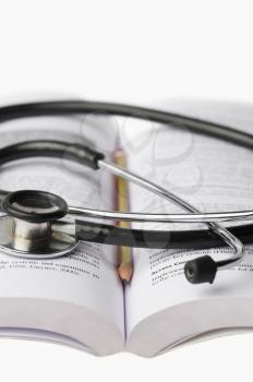 Close-up of a stethoscope on an open book