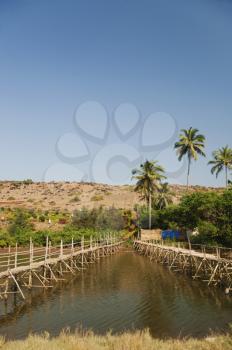 Two wooden bridges across the river, Goa, India