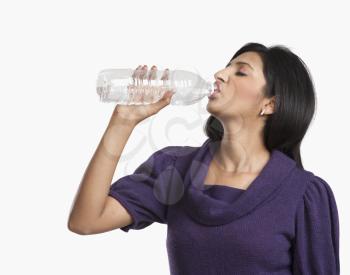 Woman drinking water with a bottle