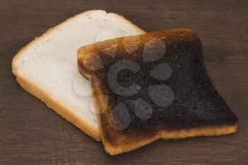 Slice of a bread with a burnt toast
