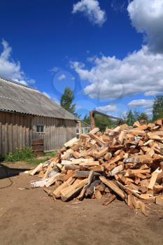 firewood in courtyard of the rural building