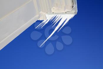 white icicles on blue background