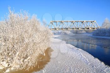 railway bridge on winter river