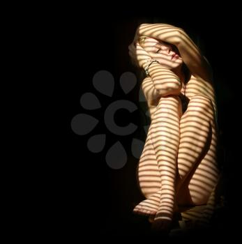 nude woman in the dark