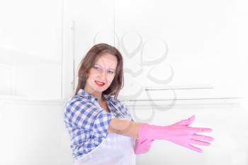 woman homemaker with rubber gloves