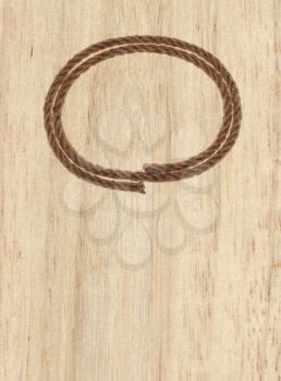 rope frame on wood background