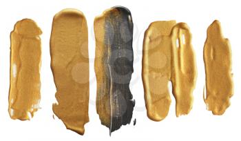 Abstract gold acrylic and watercolor brush strokes.