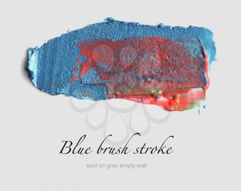 blue brush stroke on gray empty wall
