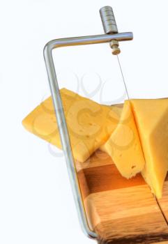 board for cutting cheese and cheese on a white background