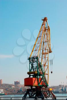 Crane loading cargo in seaport