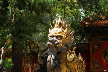 Bronze lion near the entrance to Emperor Temple in Forbidden City