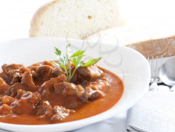 Royalty Free Photo of a Bowl of Goulash and Bread