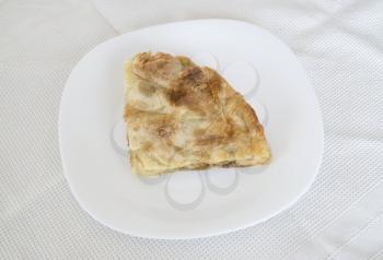 Royalty Free Photo of a Burek on a White Plate