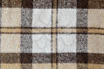 The texture of the plaid warm and domestic.