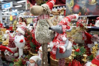 Sale of soft toys of a deer and a gray mouse for Christmas or New Year