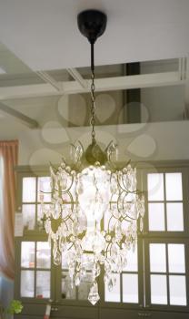 Beautiful elongated chandelier with a glow, with elements of glass.
