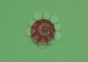 1 penny coin money (GBP), currency of United Kingdom over green background