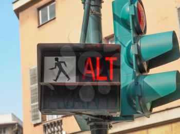 Traffic light for pedestrian crossing showing Alt sign in red meaning Stop