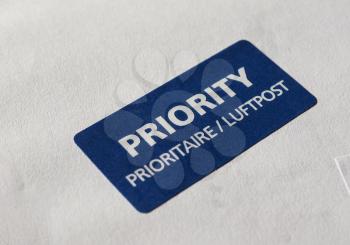 Priority (Prioritaire) mail label tag on a letter for airmail (Luftpost)