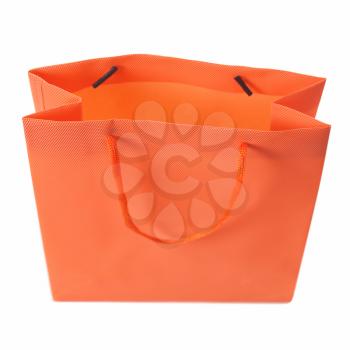 A carrier or shopping bag for goods - isolated over white background - selective focus on top