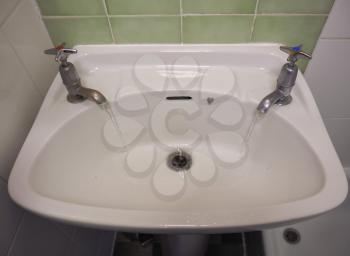 water basin with separate hot and cold water taps as used in Britain