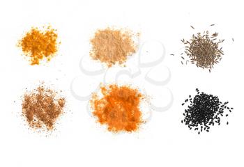 Many Indian and South American spices powder including Ginger Curry Turmeric Chili Pepper Black Cumin and Nigella Sativa over white background