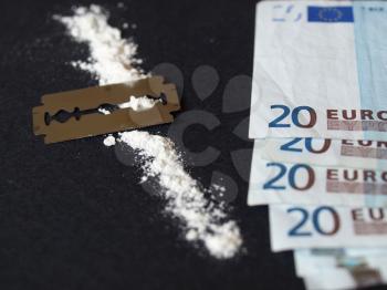 Cocaine, razor blade and money (simulation using wheat flour, no actual drugs used)