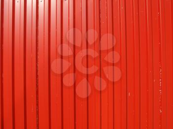 Red corrugated steel useful as a background