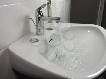 tap faucet in a bathroom basin sink