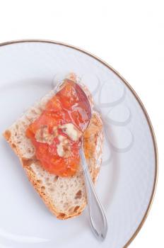 Royalty Free Photo of a Piece of Bread and Pumpkin Jam
